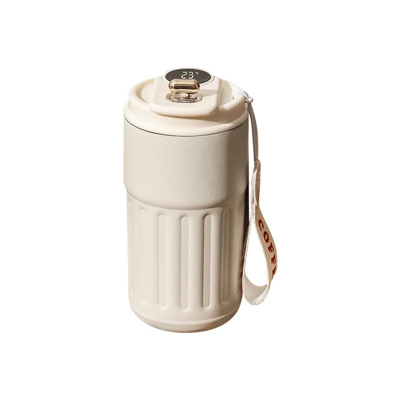 Beige insulated travel coffee mug with digital temperature display and carrying strap