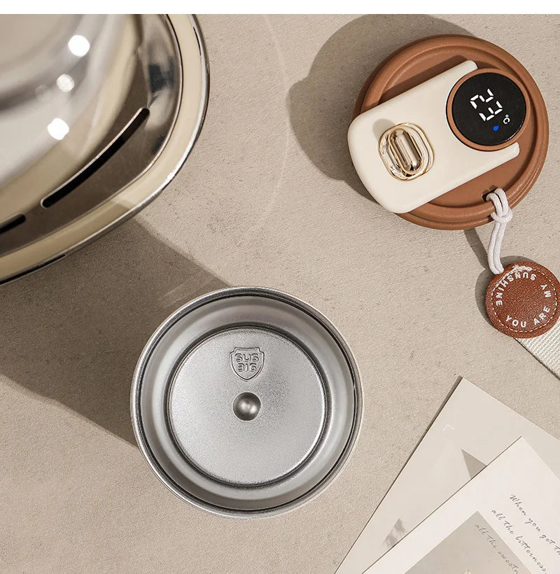 Flat lay of coffee accessories on beige surface, including a metal coffee filter, digital timer, and papers.
